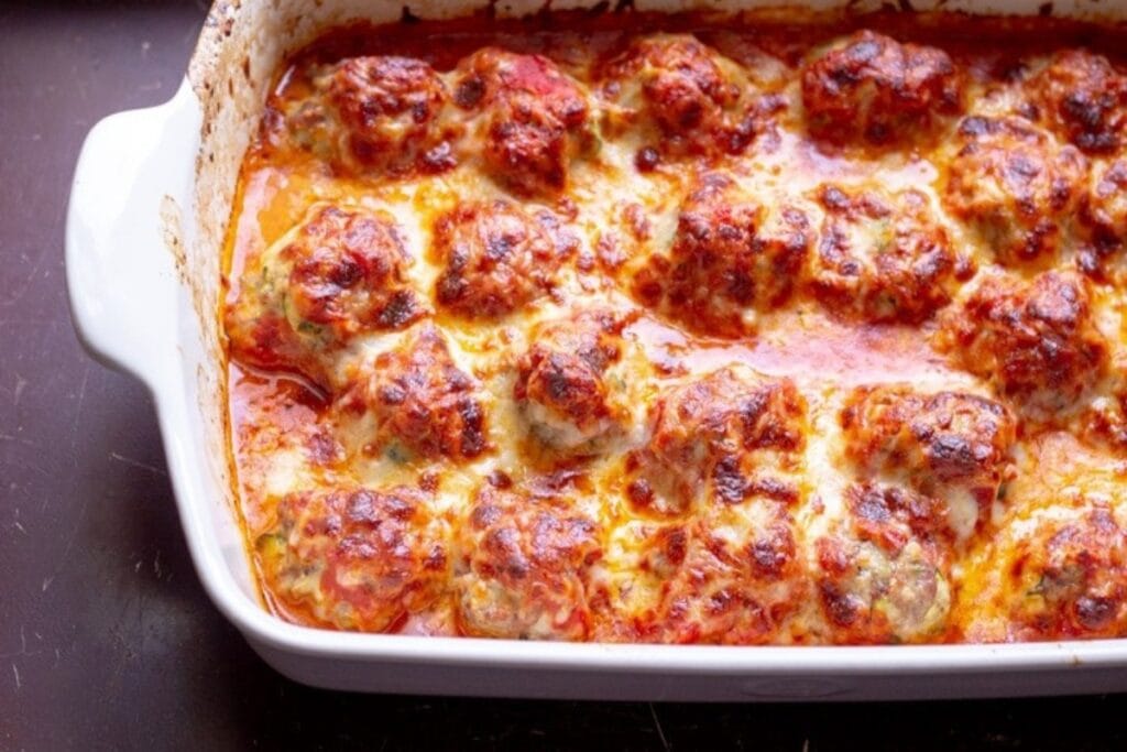 Meatball parm casserole on a rectangular baking dish.