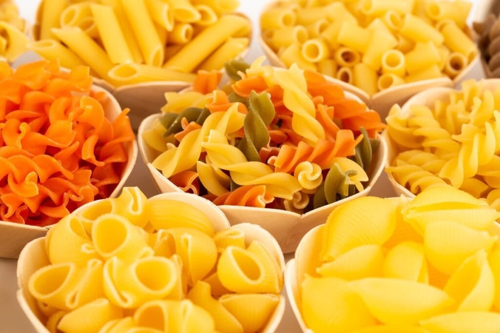 Different kinds of pasta in bowls.