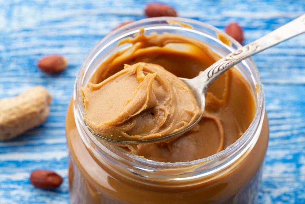 Peanut butter scooped with a spoon.