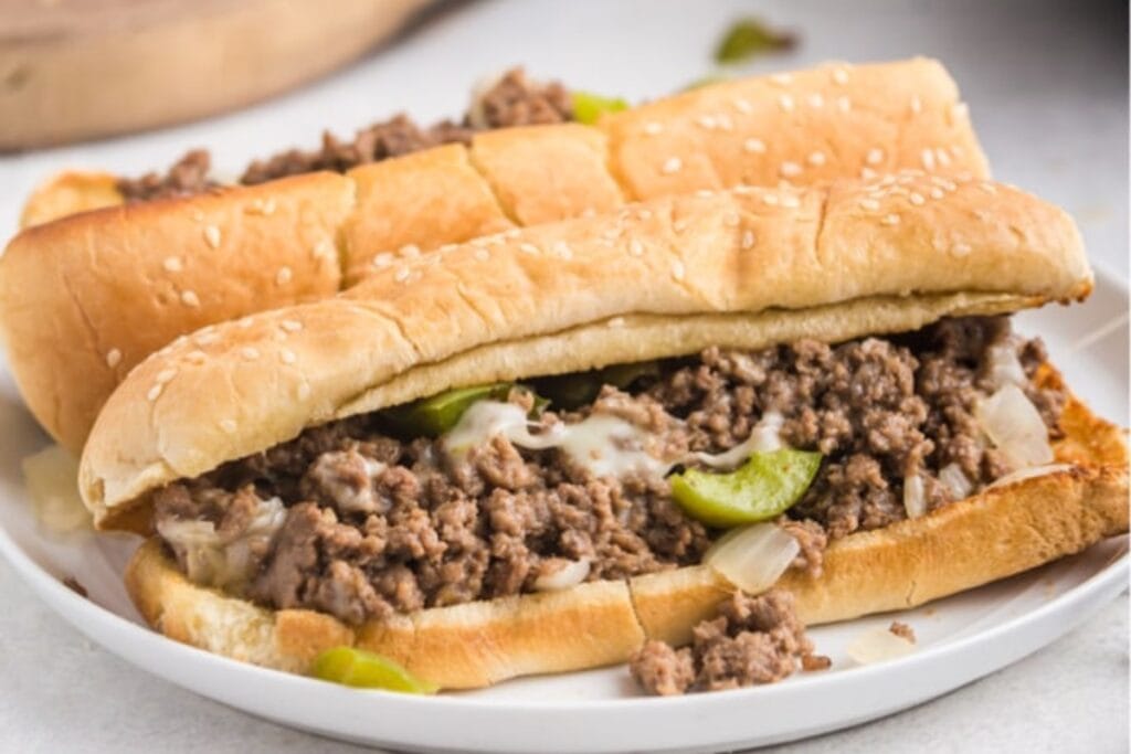 Philly cheesesteak sloppy joes served on a plate.