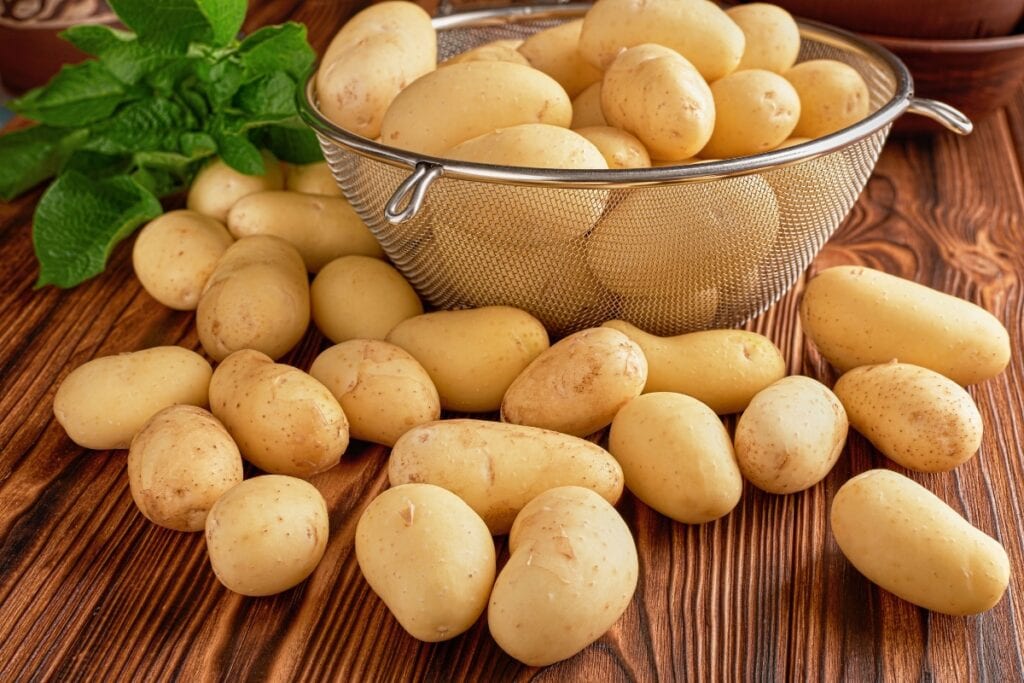 Potatoes on a wooden table.