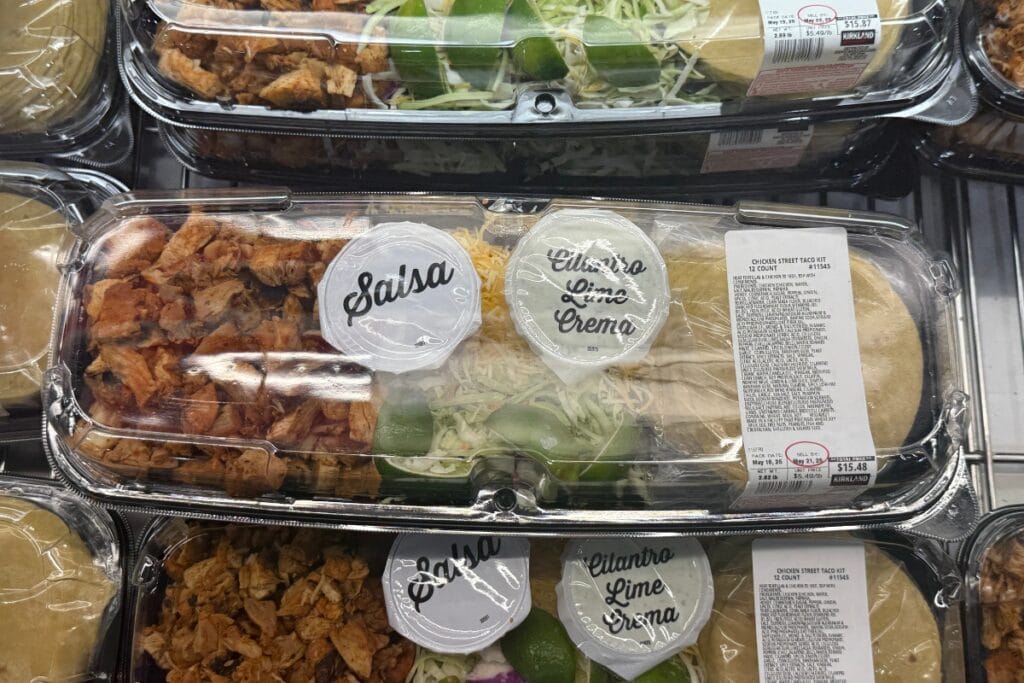 Prepared chicken street taco meal on a store shelf.