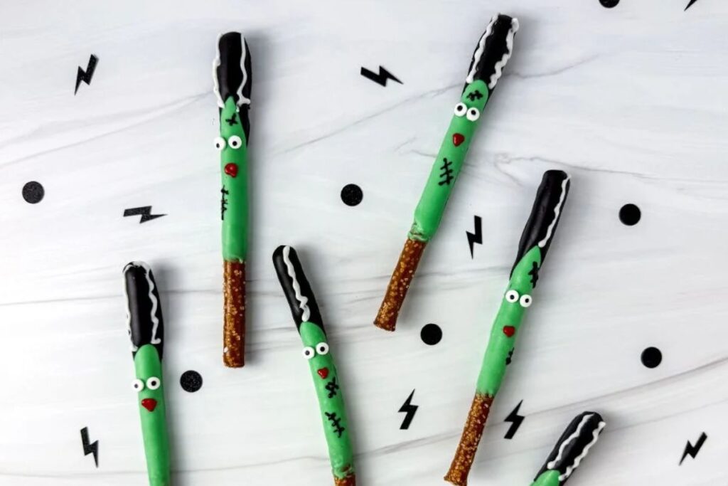 Halloween pretzels decorated like green bride of frankensteins.