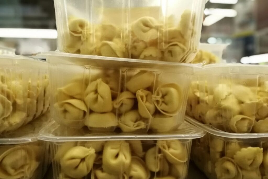 Refrigerated ravioli in plastic container.