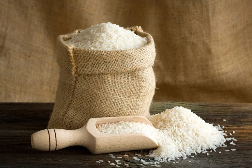 Bag of rice on a wooden table.