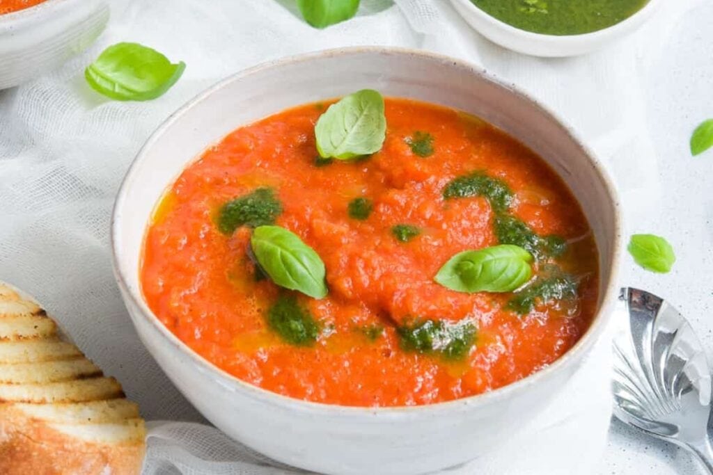 Roasted red pepper soup in a bowl.
