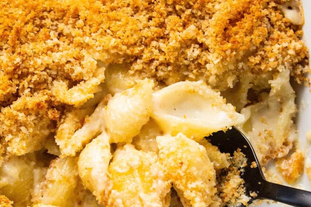 Close-up of smoked gouda mac and cheese on a spoon.