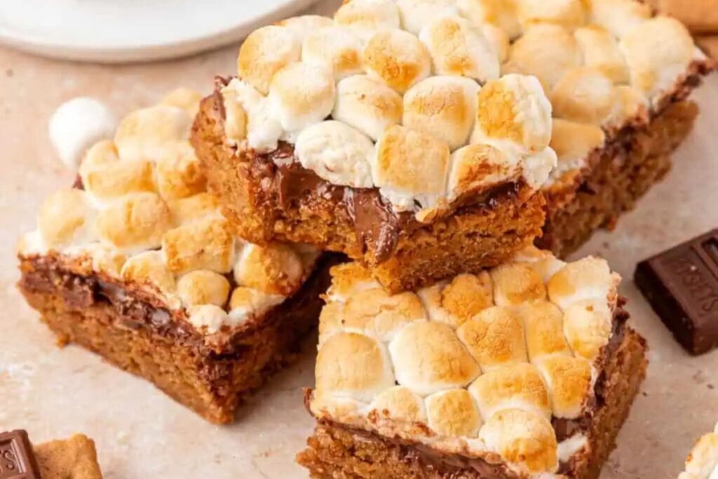 S’mores bars with melted chocolate and toasted marshmallows on top.