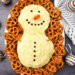 A close up shot of snowman cheeseball.