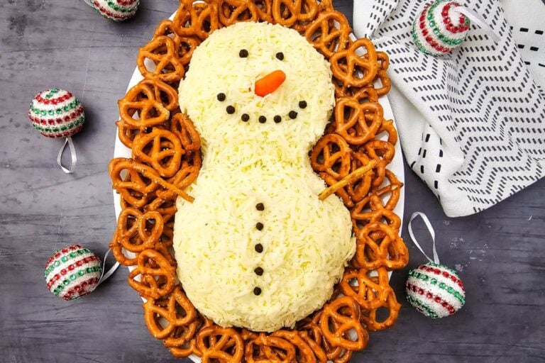 A close up shot of snowman cheeseball.