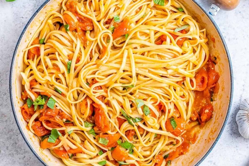 Tomato basil pasta in a skillet.