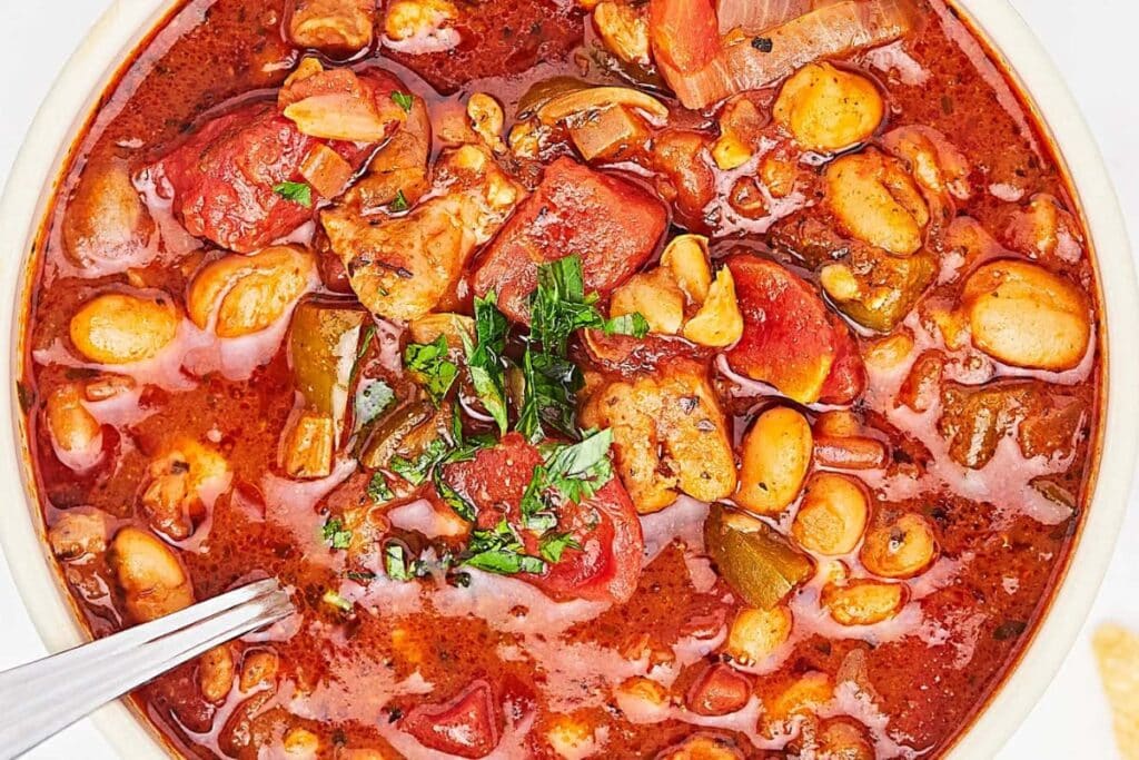 Top view of white bean chicken chili in a bowl.