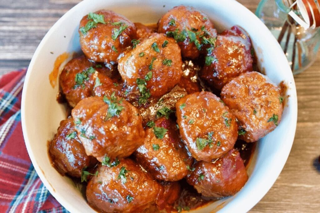 A close up shot of cranberry meatballs.
