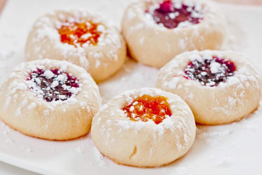 A close up shot of thumbprint cookies.