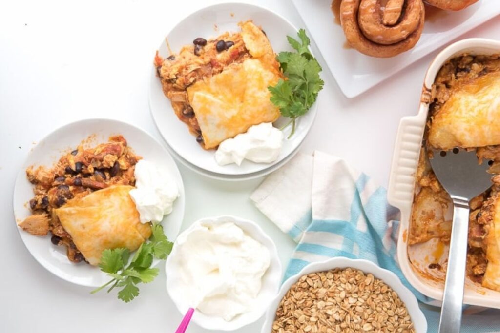 Chicken tortilla casserole on plates, in baking dish, and with toppings.