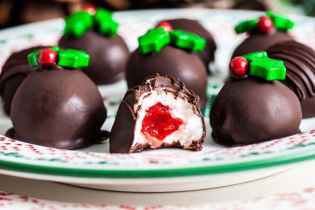 A close up shot of chocolate covered cherries.
