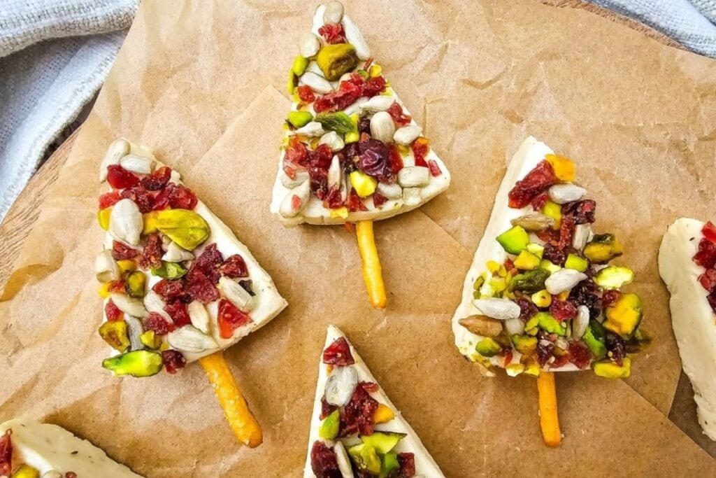 A close up shot of Christmas cheese appetizers.
