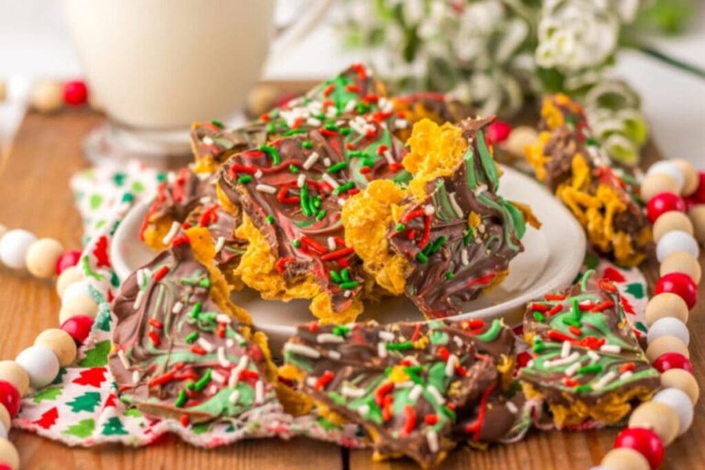 Christmas cornflake brittle with chocolate and sprinkles on a plate.