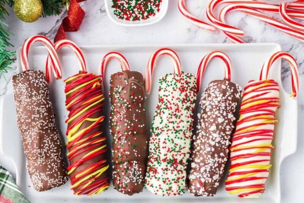 A close up shot of Christmas marshmallow pops.