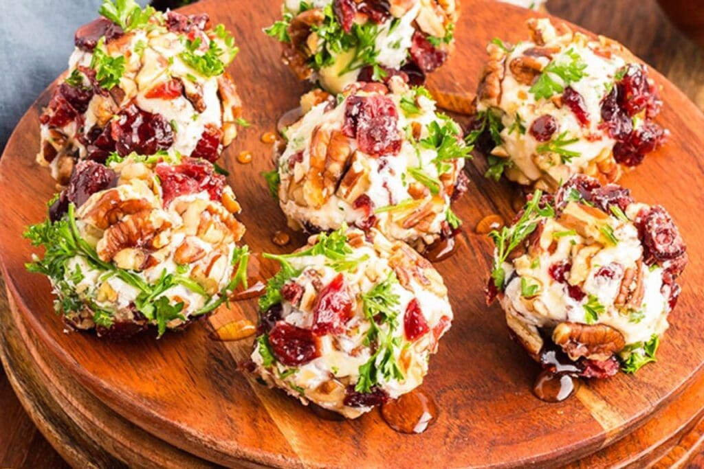 A close up shot of cranberry goat cheese balls.