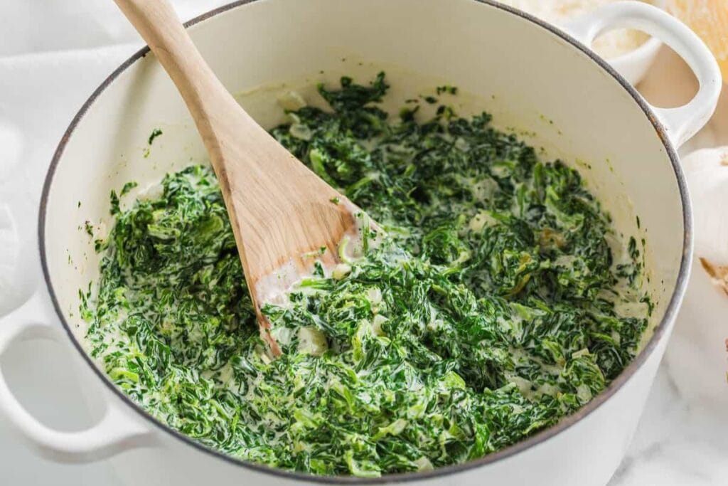 A close up shot of creamed spinach.