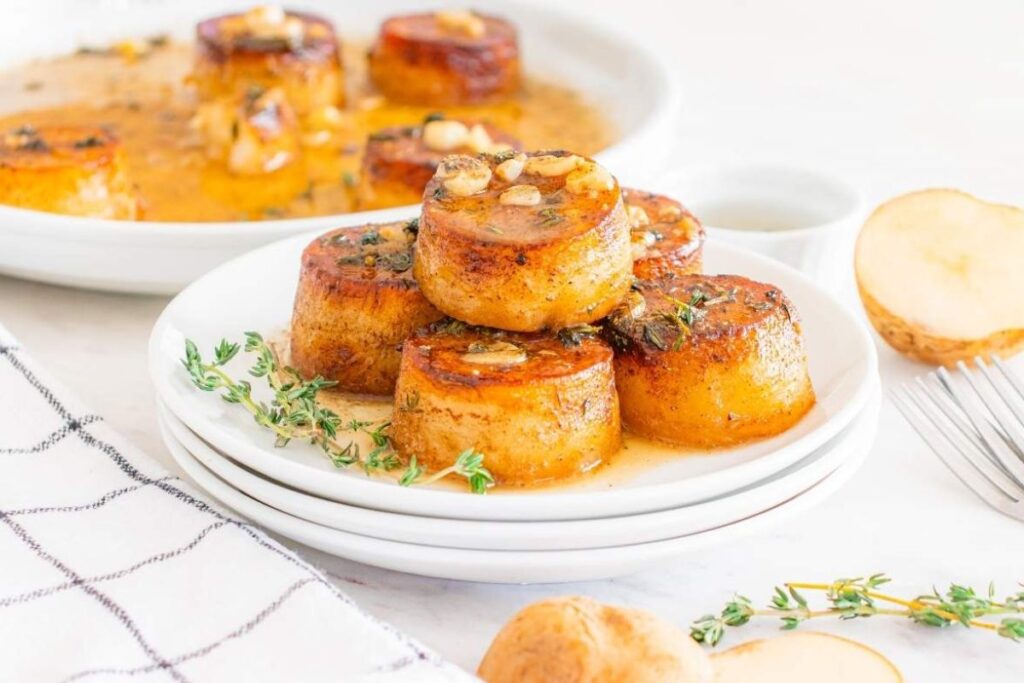 A close up shot of fondant potatoes.
