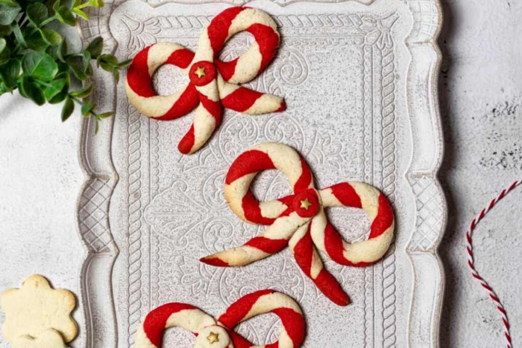 A close up shot of Christmas bow cookies.