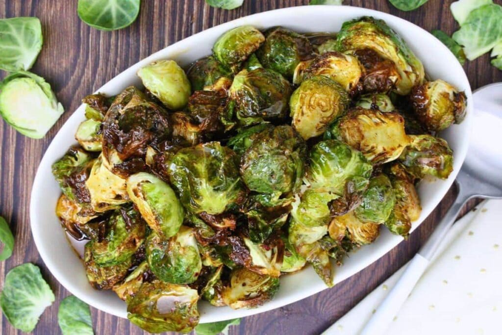 LongHorn Brussel Sprouts on a white plate.