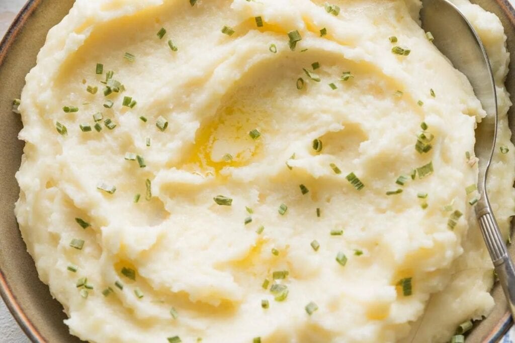 A close up shot of mashed potatoes.