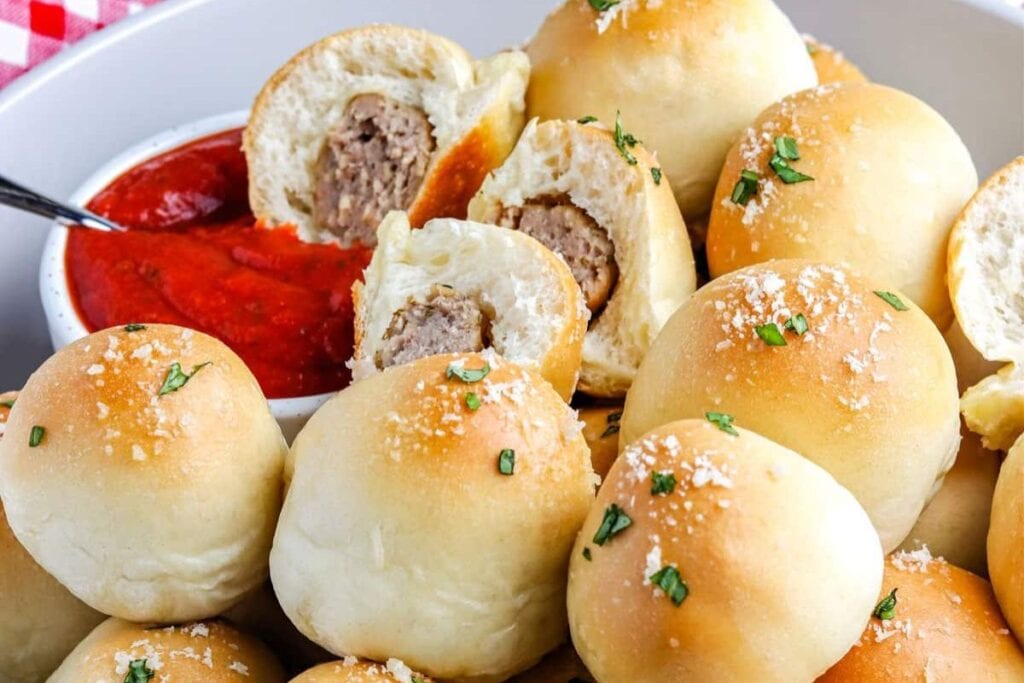 A close up shot of meatball sub bites.