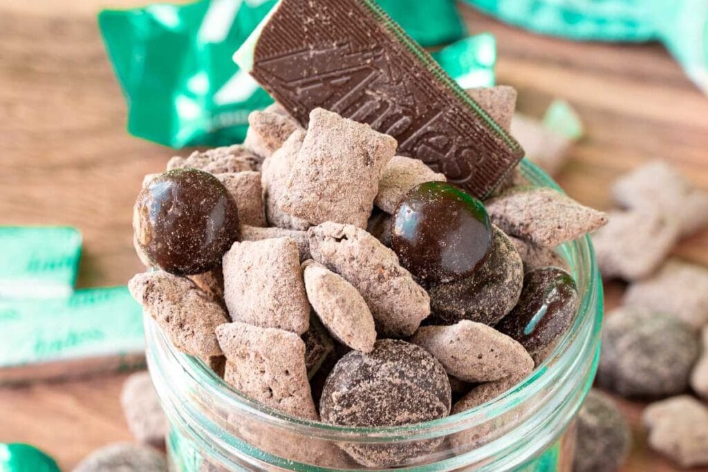 A close up shot of chocolate muddy buddies.