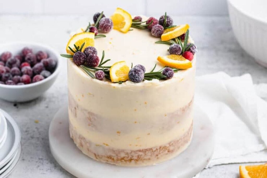 A close up shot of orange cranberry cake.