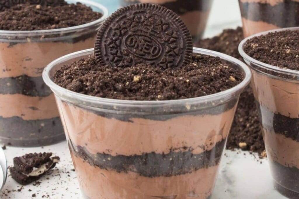 Oreo dirt pudding cups with chocolate pudding and crushed Oreos.