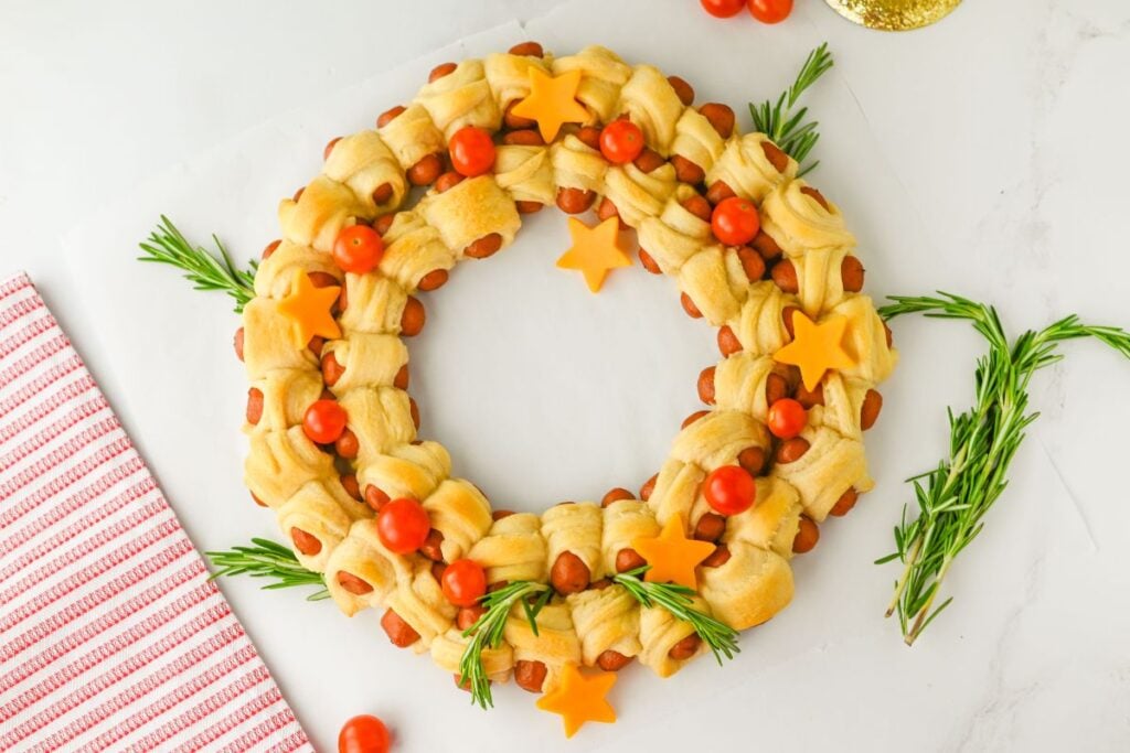 A close up shot of pigs in a blanket wreath.