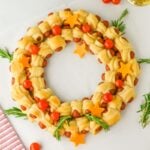 A close up shot of pigs in a blanket wreath.