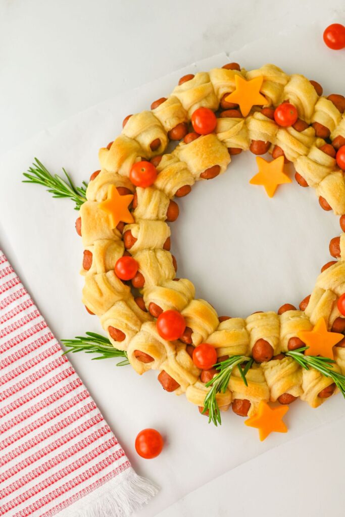 A close up shot of pigs in a blanket wreath.