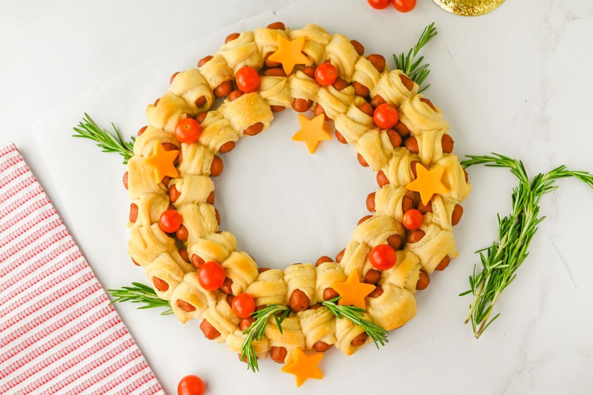 A close up shot of pigs in a blanket wreath.