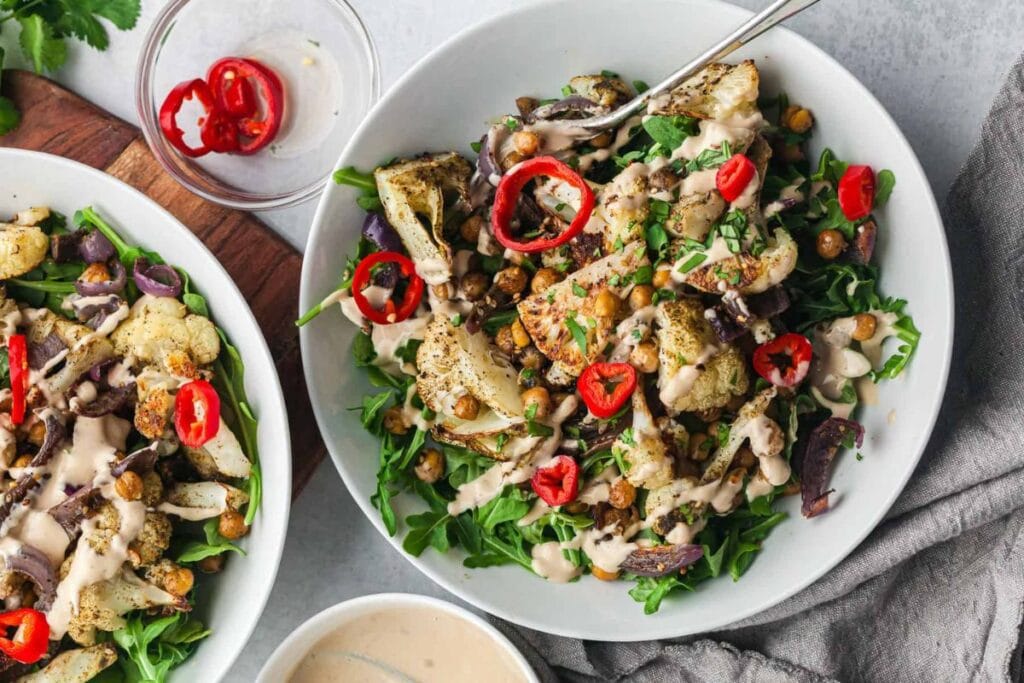 Roasted cauliflower salad with chickpeas, red onion, and chili peppers.
