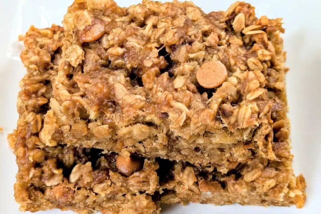 Two peanut butter banana oatmeal bars stacked on top of each other.