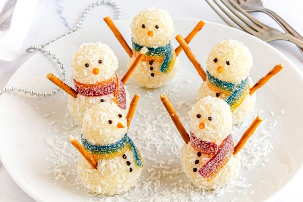 A close up shot of snowman coconut balls.