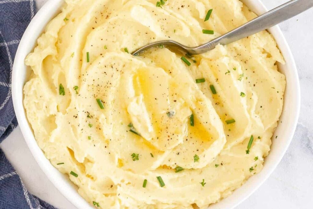 A close up shot of mashed potatoes.