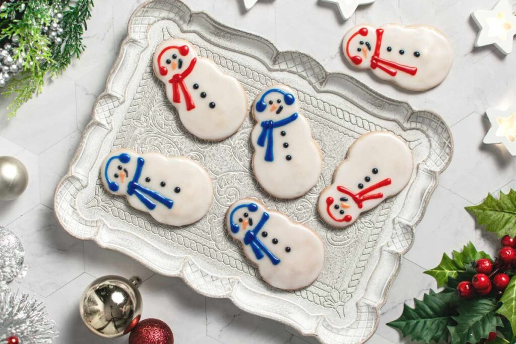 A close up shot of snowman cookies.