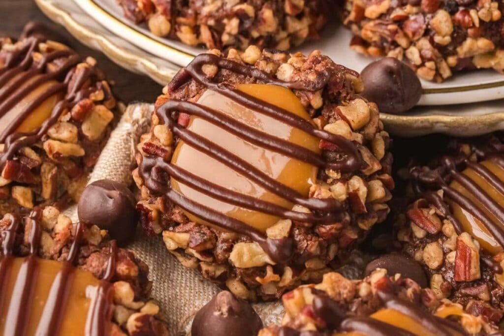 A close up shot of turtle thumbprint cookies.