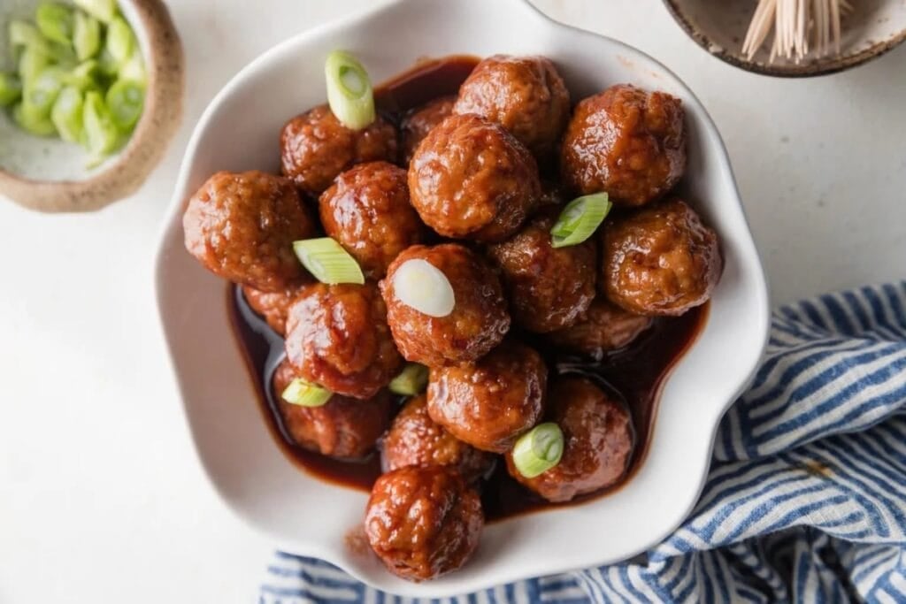 BBQ meatballs in a white bowl.
