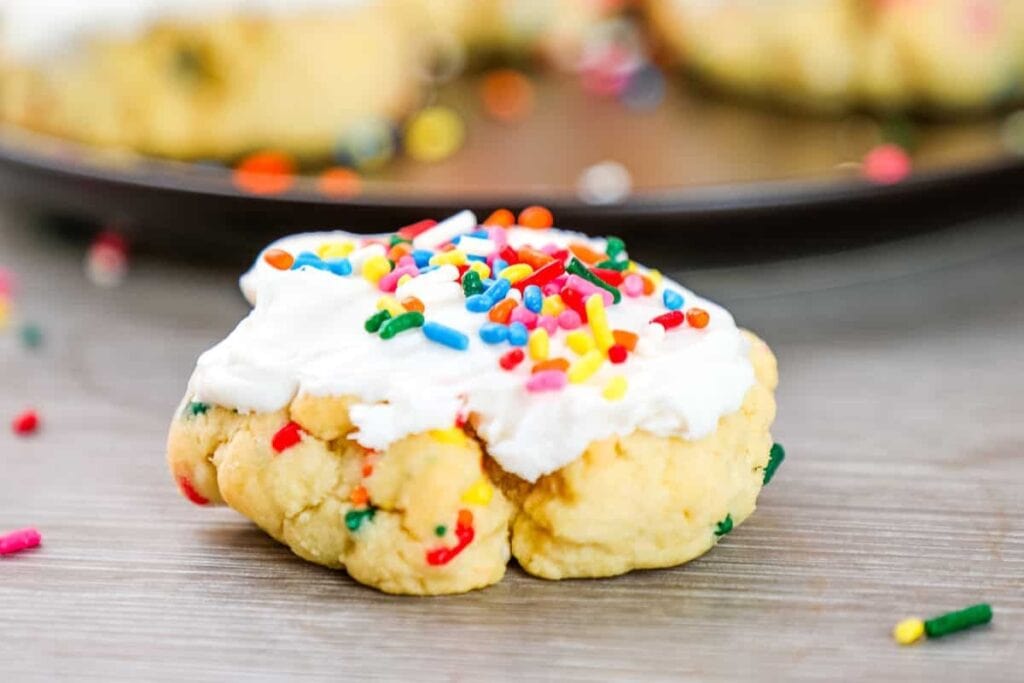 Birthday cake cookies topped with colorful sprinkles.