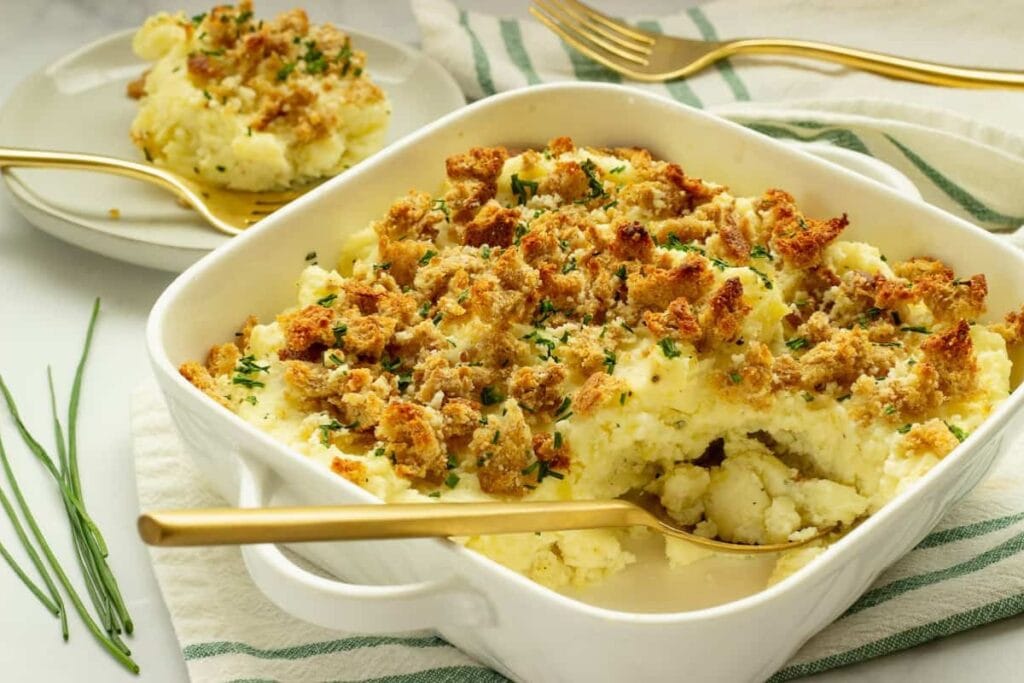 Boursin mashed potatoes in a white square baking dish.