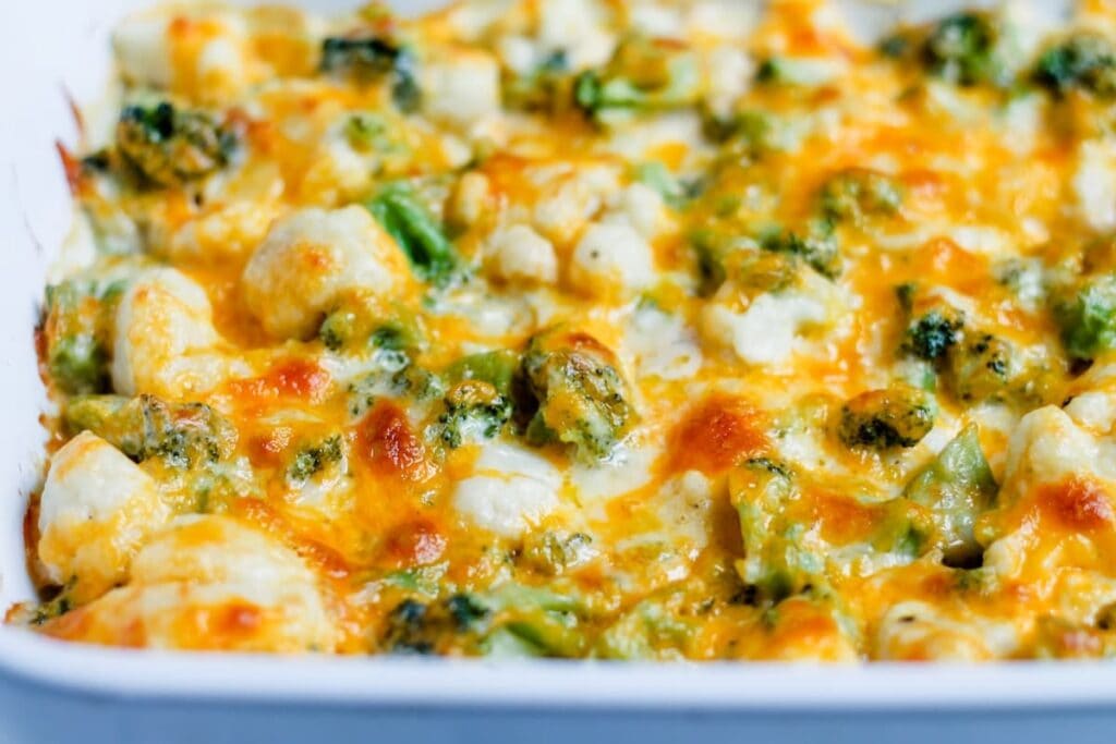 Close-up of Broccoli Cauliflower Cheese Casserole in a baking dish.