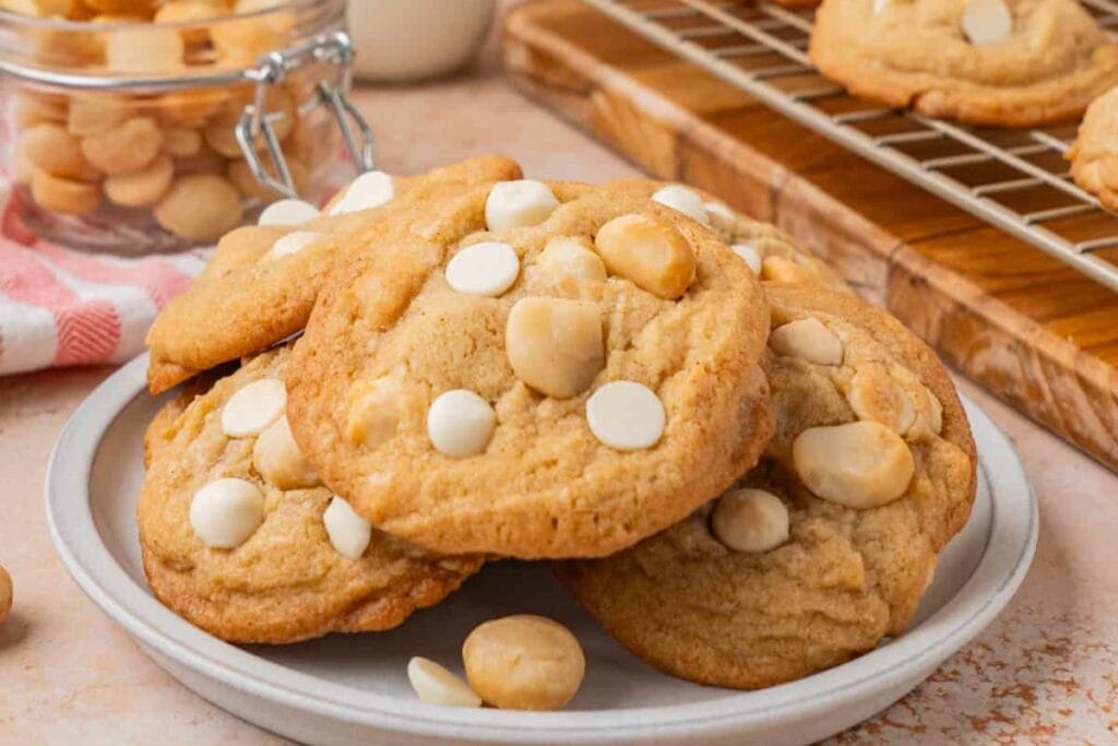 Brown butter macadamia nut cookies on a plate.