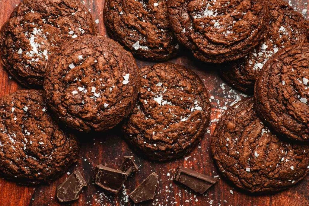Top view of brownie cookies on a wooden table.