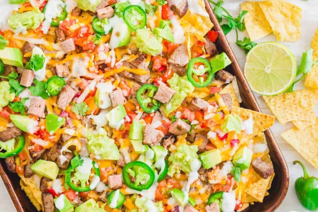 Carne asada nachos on a tray.